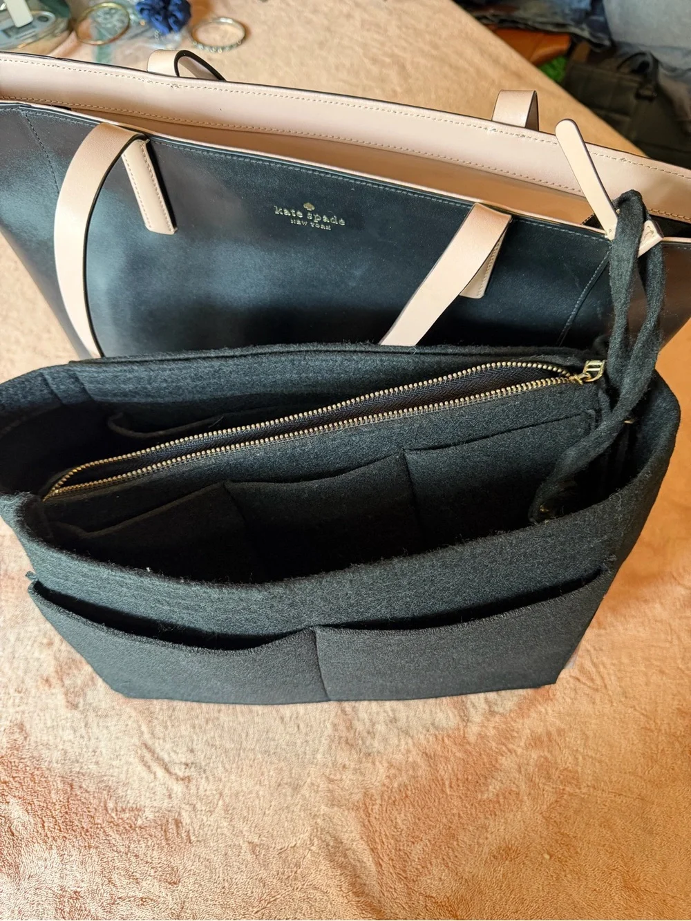 kate spade black tote with cream straps and floral charm